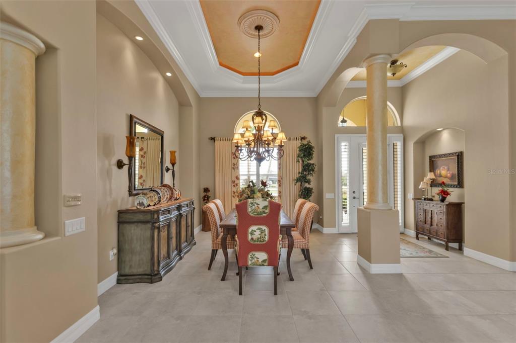 5021 Sable Key Circle Punta Gorda, FL 33955 - Photo 10 of 77 a view of a dining room with furniture and chandelier