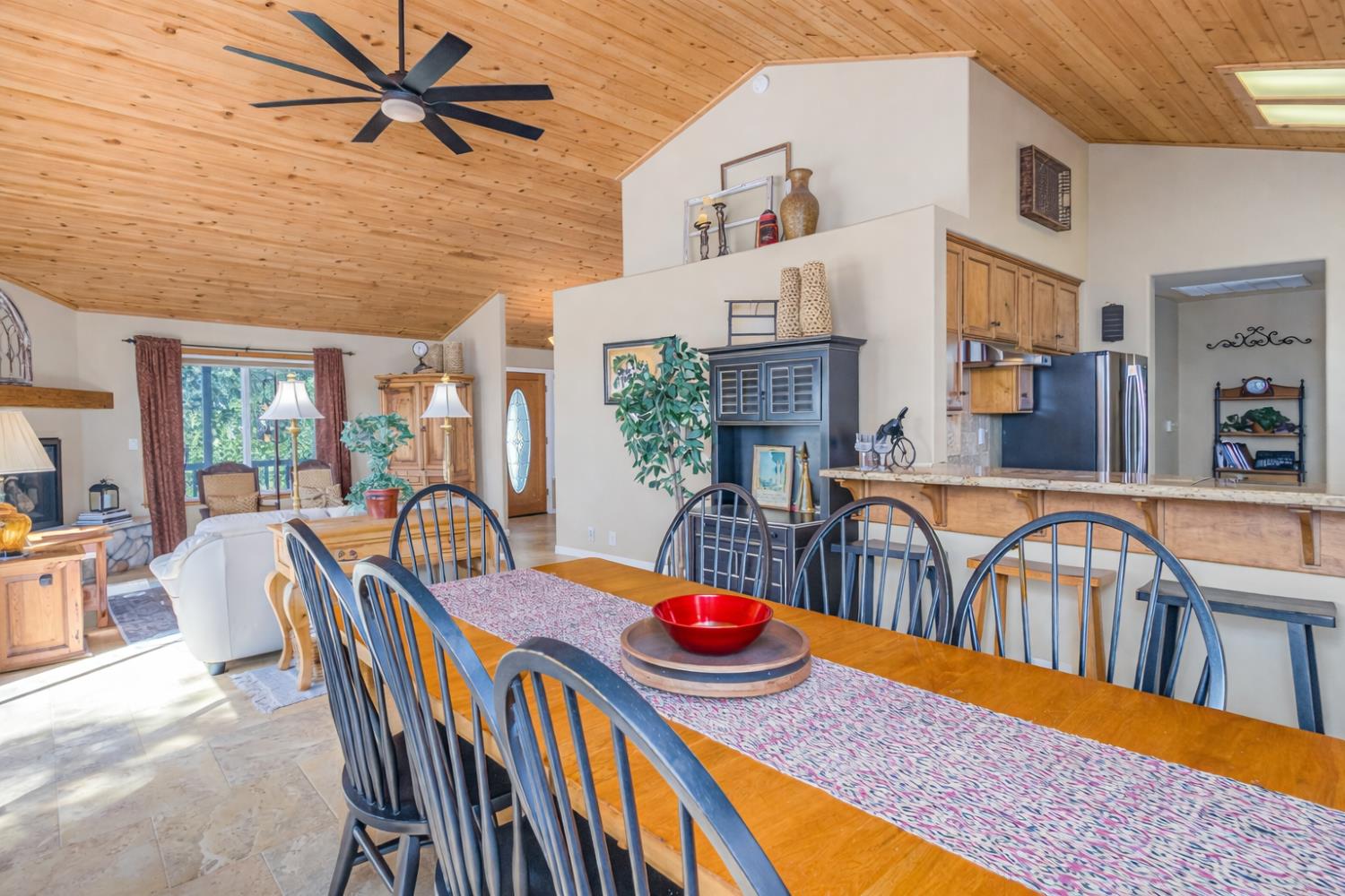 9290 Cramer Road Auburn, CA 95602 - Photo 19 of 67 a view of a dining room and hall with furniture