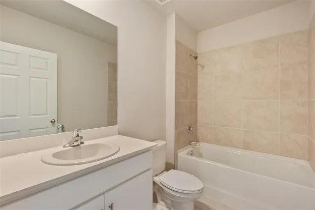 a bathroom with a sink a toilet and a bathtub