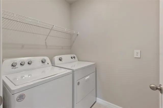 a utility room with dryer and washer