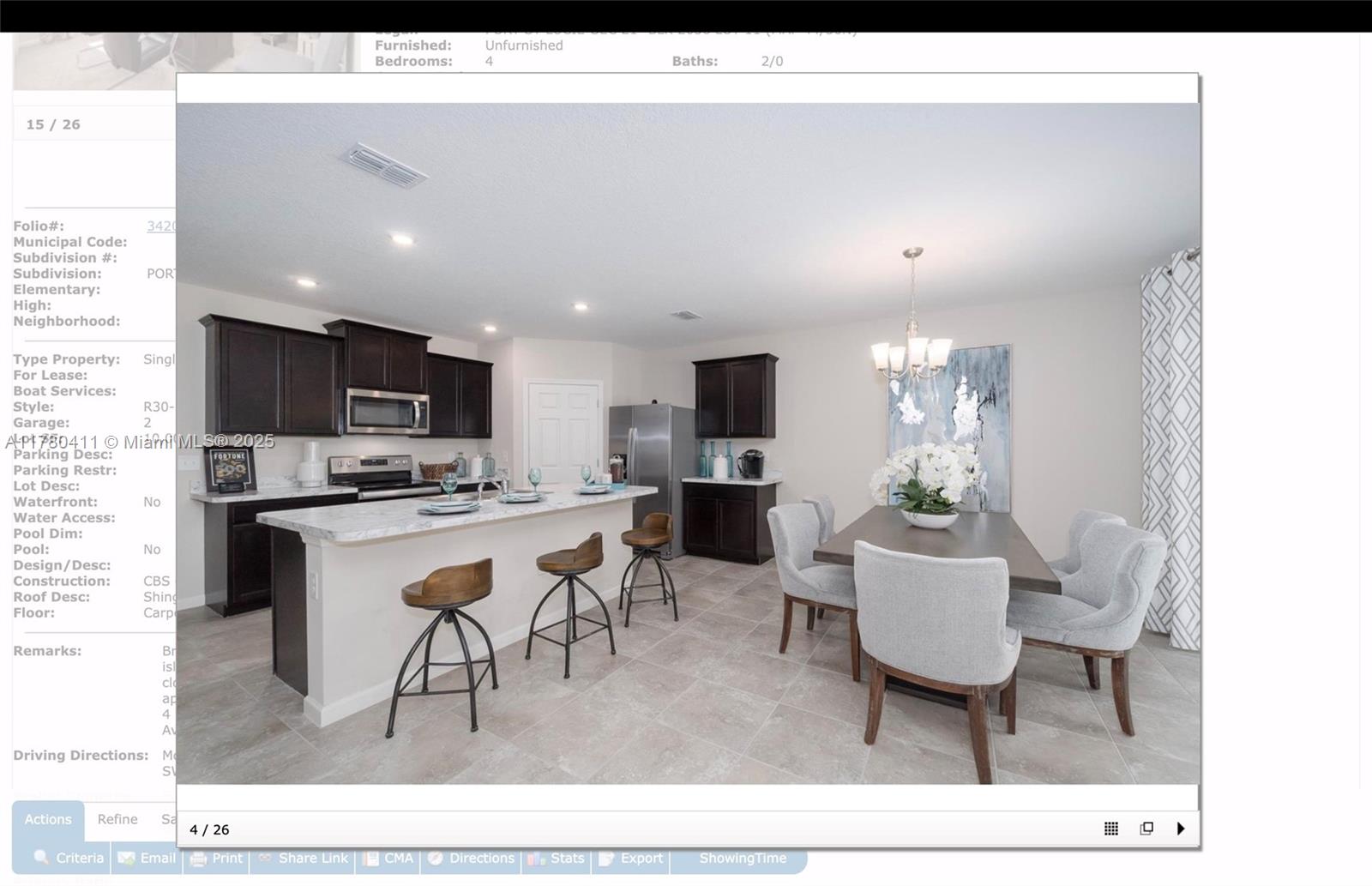 3743 Southwest Port St Lucie Boulevard Port St. Lucie, FL 34953 - Photo 13 of 22 a living room with stainless steel appliances kitchen island granite countertop a view of kitchen dining table and chairs