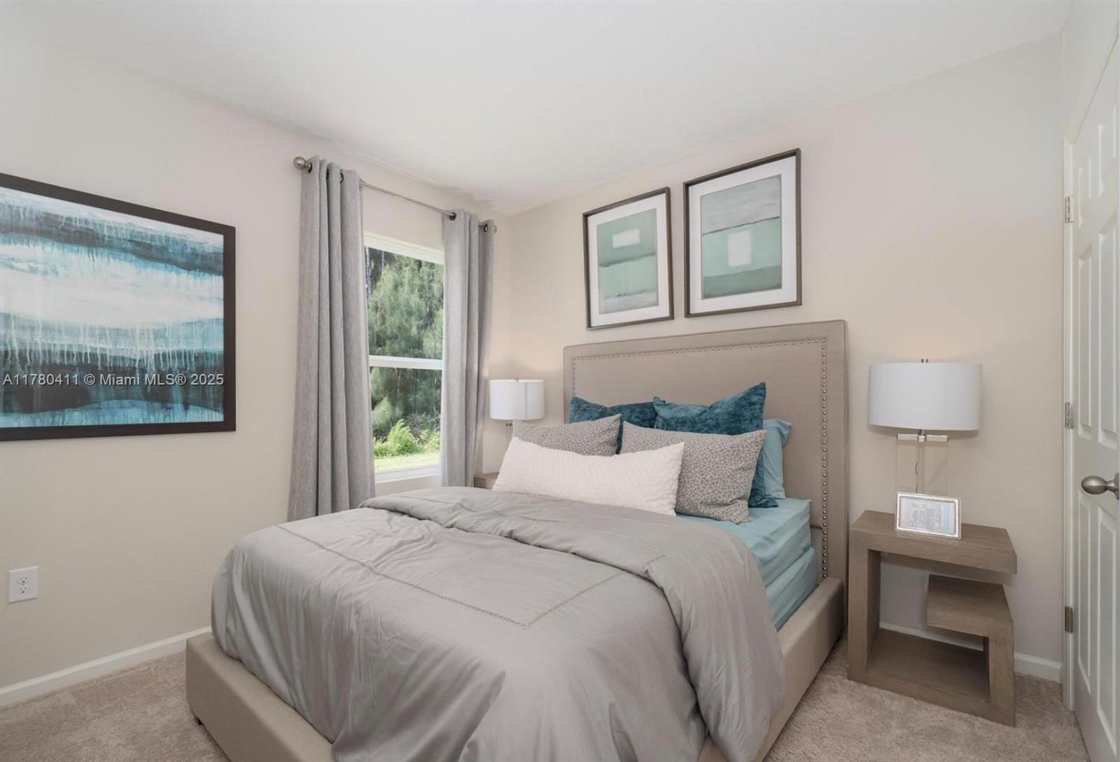 3743 Southwest Port St Lucie Boulevard Port St. Lucie, FL 34953 - Photo 16 of 22 a bedroom with a bed and a window