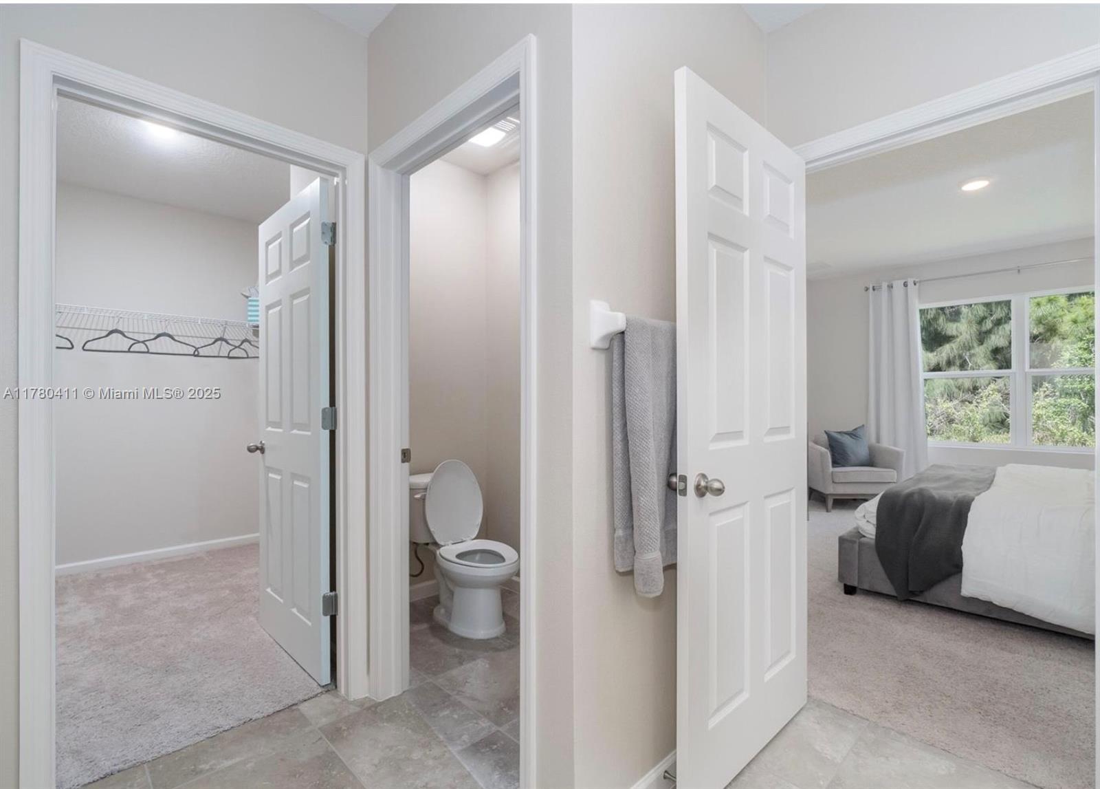 3743 Southwest Port St Lucie Boulevard Port St. Lucie, FL 34953 - Photo 17 of 22 a bathroom with a granite countertop sink mirror and a toilet