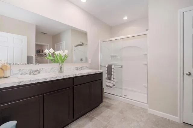 a dining room with furniture and potted plant