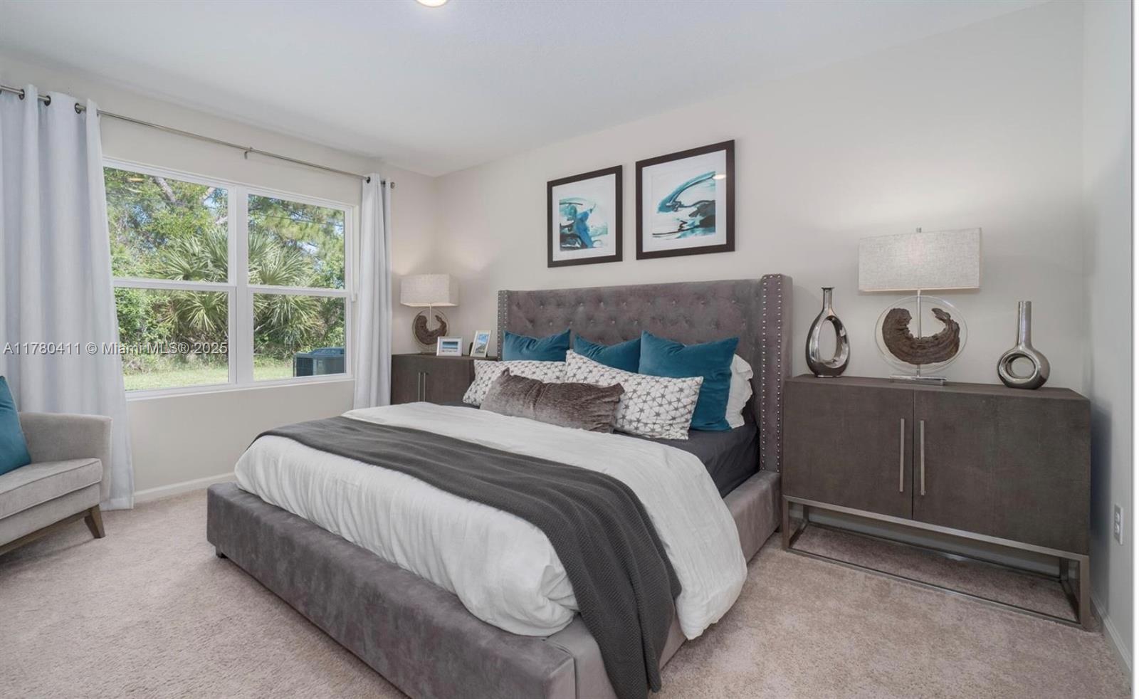 3743 Southwest Port St Lucie Boulevard Port St. Lucie, FL 34953 - Photo 2 of 22 a bed room with a bed and a chair