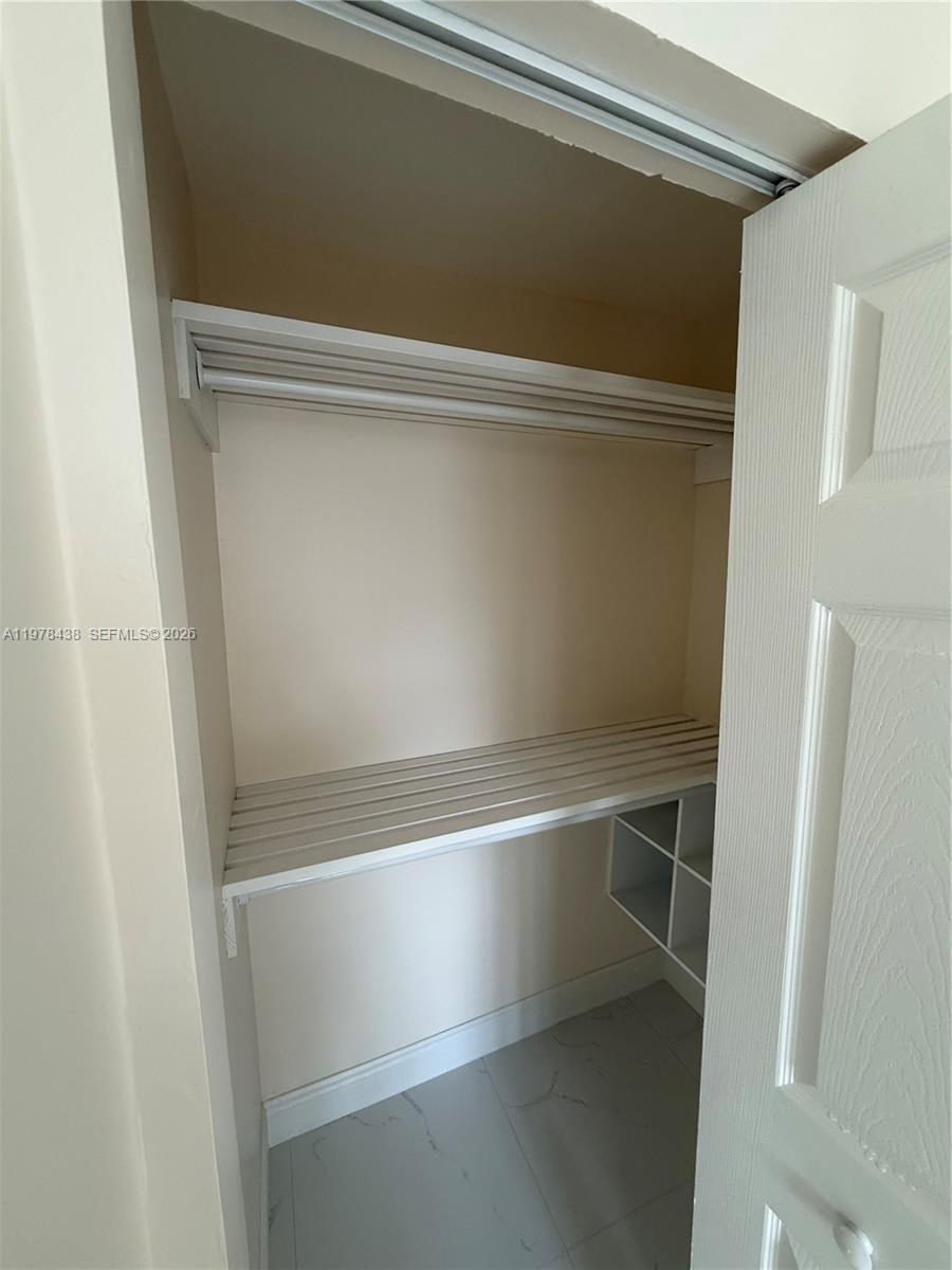 11690 Southwest 185th Street, Unit 1 Miami, FL 33157 - Photo 11 of 11 a view of closet