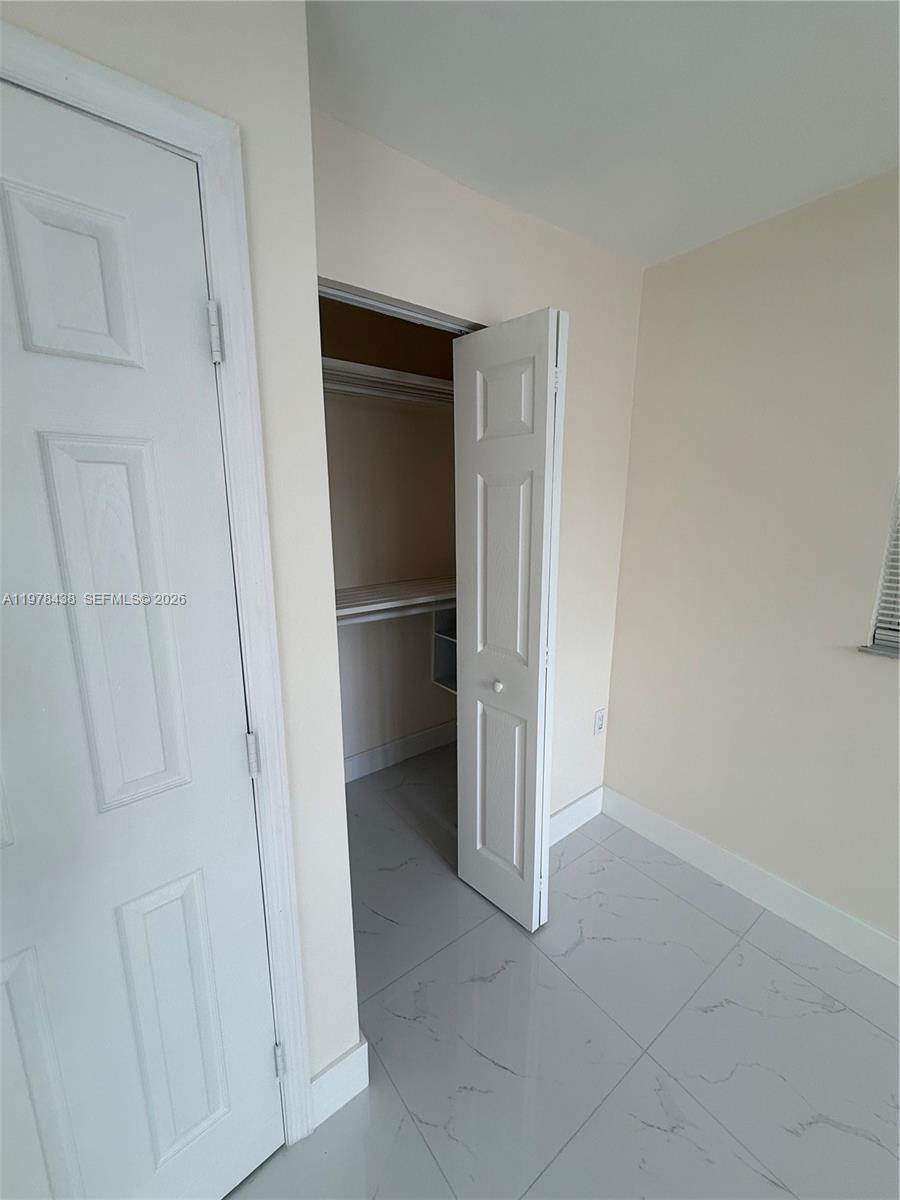 11690 Southwest 185th Street, Unit 1 Miami, FL 33157 - Photo 10 of 11 a view of an empty room