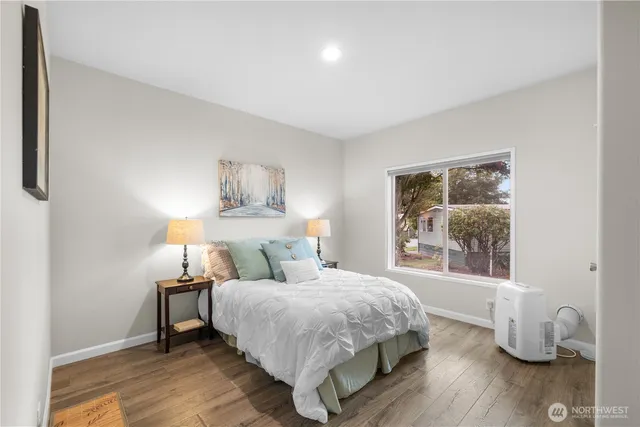 a bedroom with a bed and a window