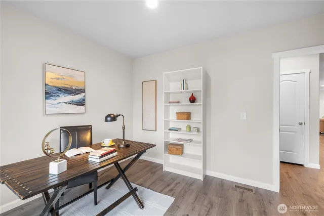 a workspace with furniture and wooden floor