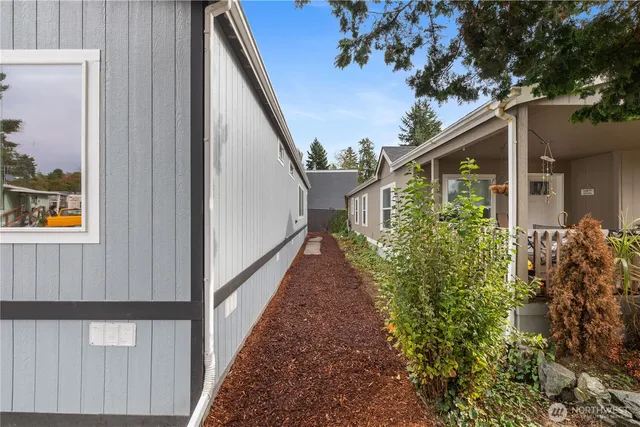 a view of a balcony with flower plants