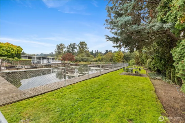 a view of a swimming pool with an outdoor seating