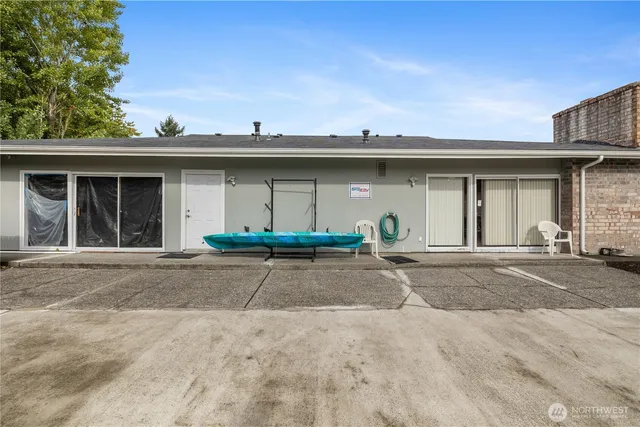 a view of a white house with a outdoor space