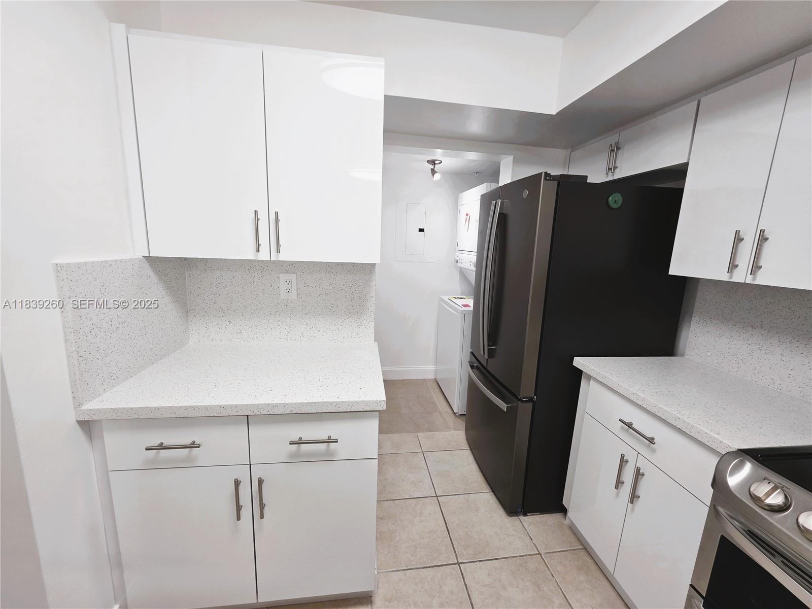 2620 South University Drive, Unit 111 Davie, FL 33328 - Photo 15 of 49 a kitchen with a refrigerator sink and cabinets