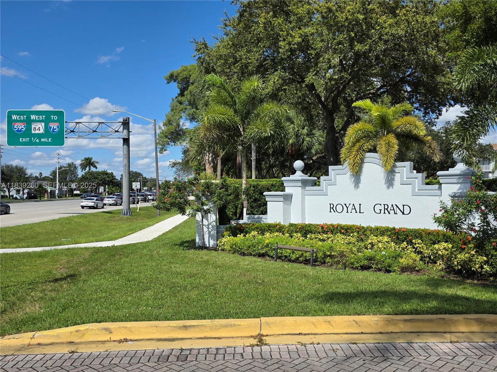 2620 South University Drive, Unit 111 Davie, FL 33328 - Photo 4 of 49 a view of a house with a big yard and potted plants