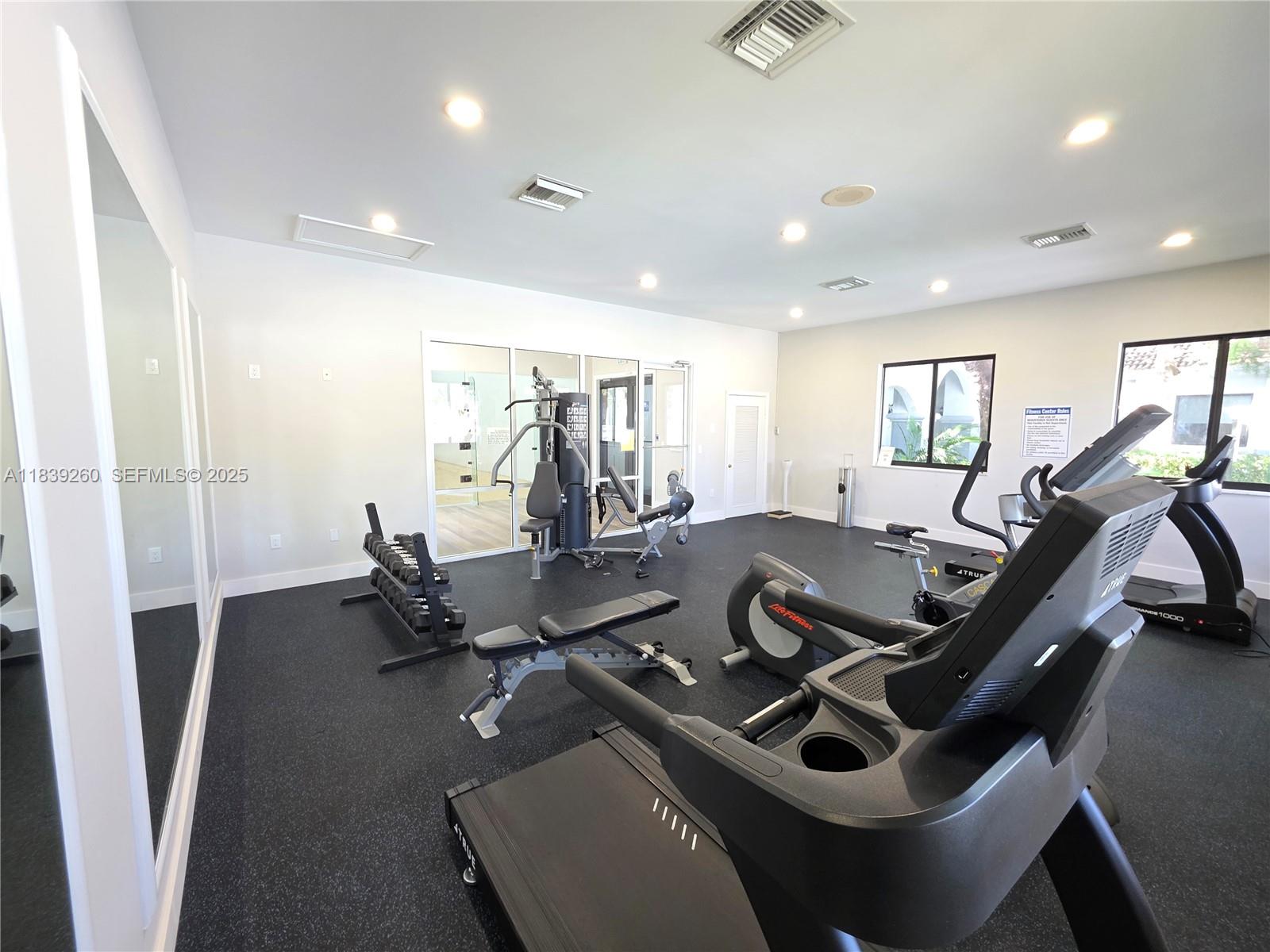 2620 South University Drive, Unit 111 Davie, FL 33328 - Photo 43 of 49 a living room with furniture gym equipment and a view of living room
