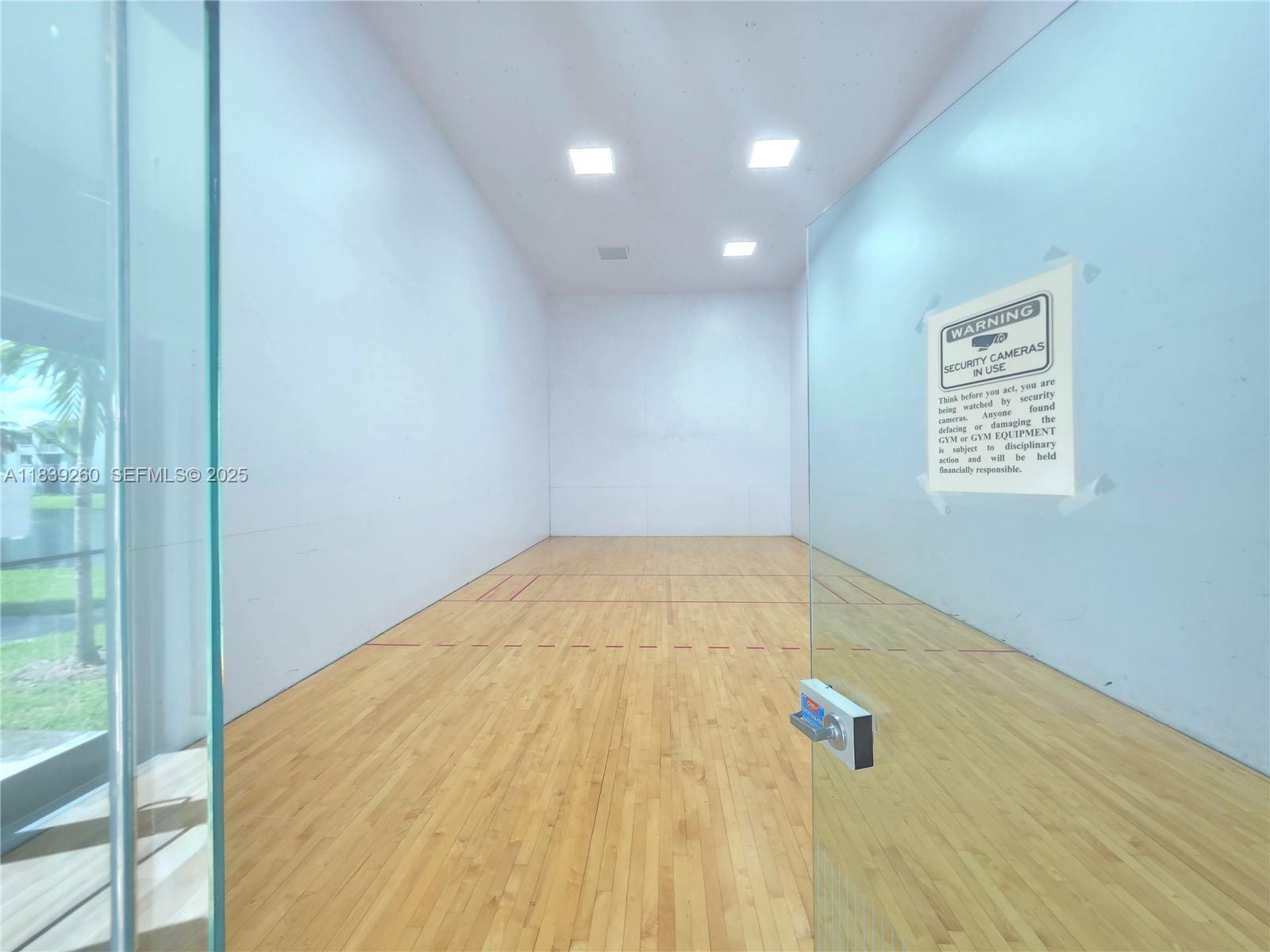 2620 South University Drive, Unit 111 Davie, FL 33328 - Photo 44 of 49 a view of empty room with wooden floor