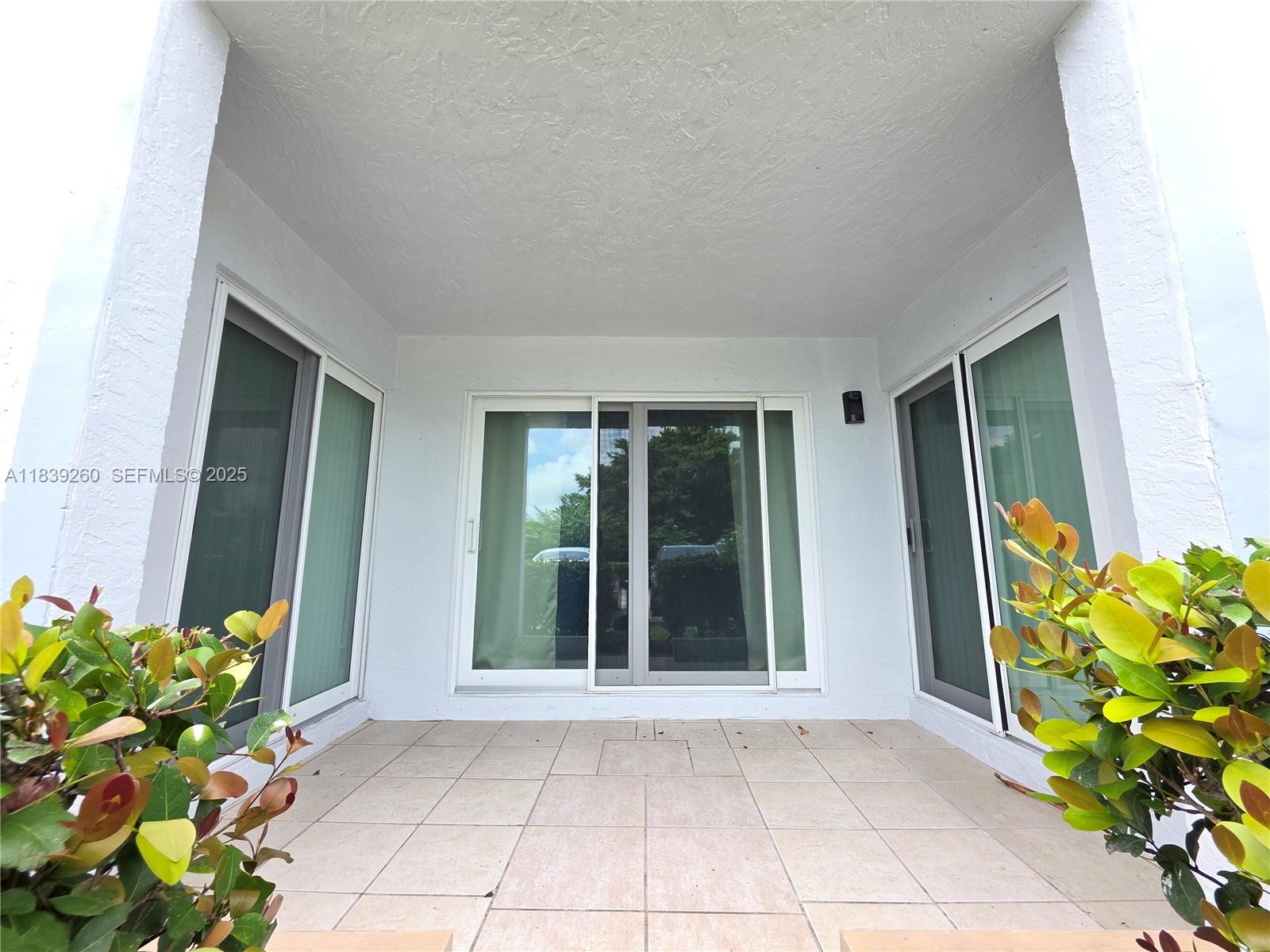 2620 South University Drive, Unit 111 Davie, FL 33328 - Photo 7 of 49 All sliding doors and windows feature impact-resistant glass for enhanced safety and durability.