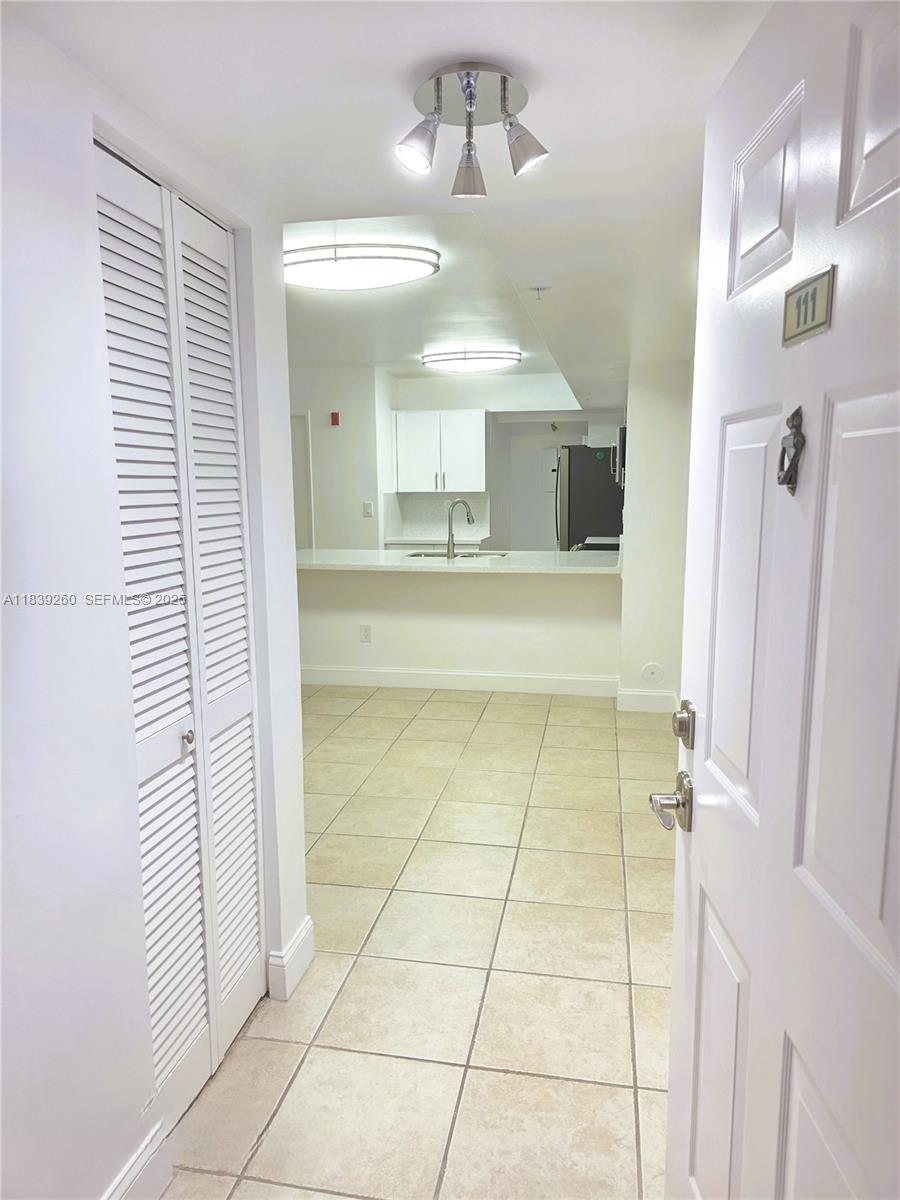 2620 South University Drive, Unit 111 Davie, FL 33328 - Photo 10 of 49 a bathroom with a mirror and a shower