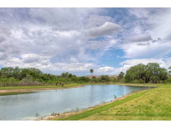 a view of a lake with a big yard