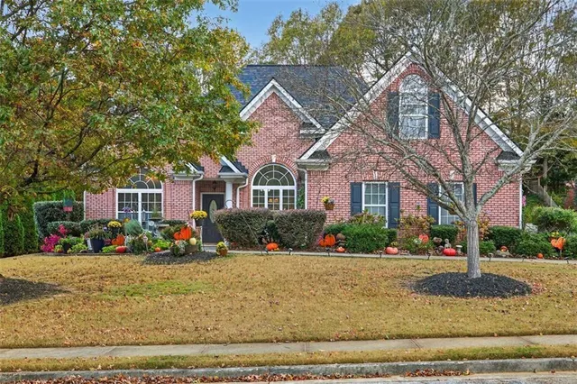 a living room with furniture fireplace and flat screen tv