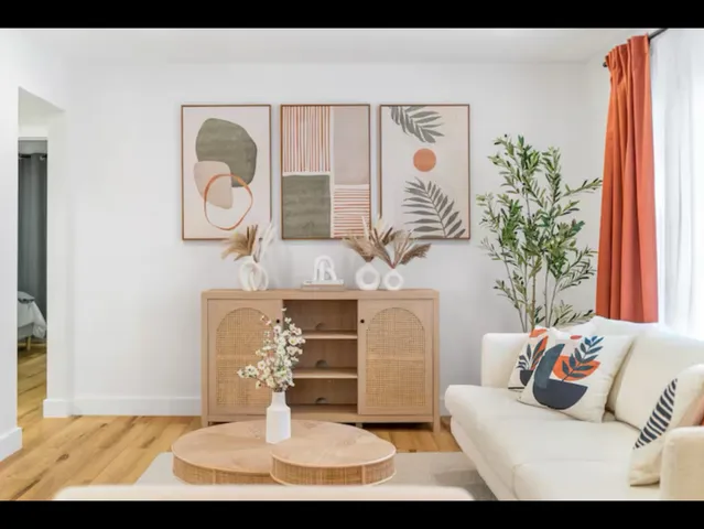 a living room with furniture and window