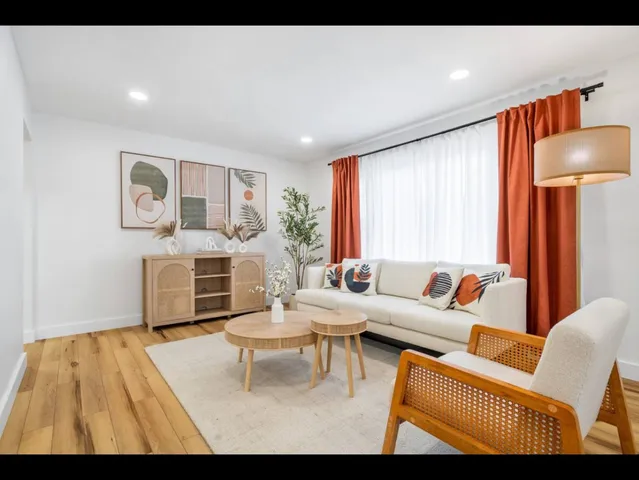 a living room with furniture and a table