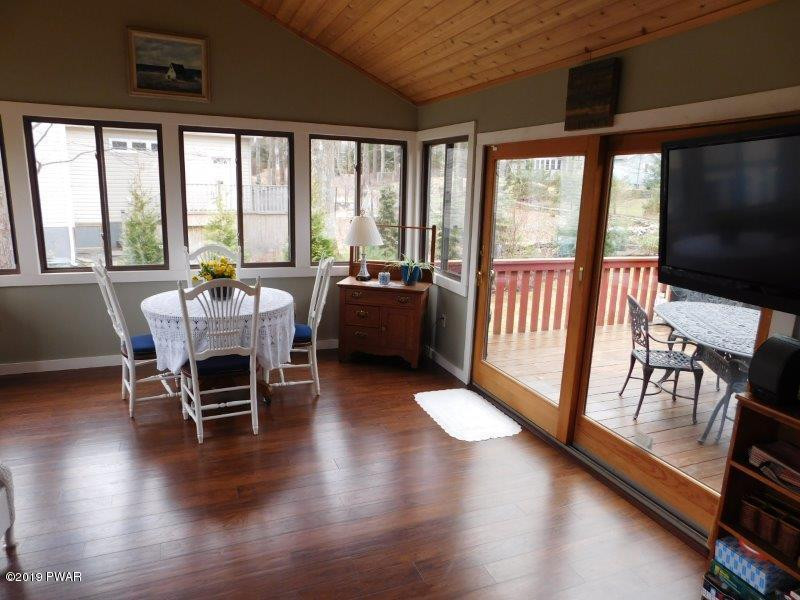 102 Rodeo Lane Hawley, PA 18428 - Photo 16 of 52 a view of a dining room with furniture window and wooden floor
