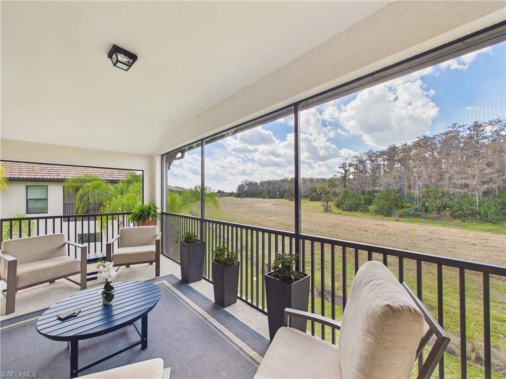 5683 Mayflower Way, Unit 908 Ave Maria, FL 34142 - Photo 3 of 37 Sunroom with lofted ceiling