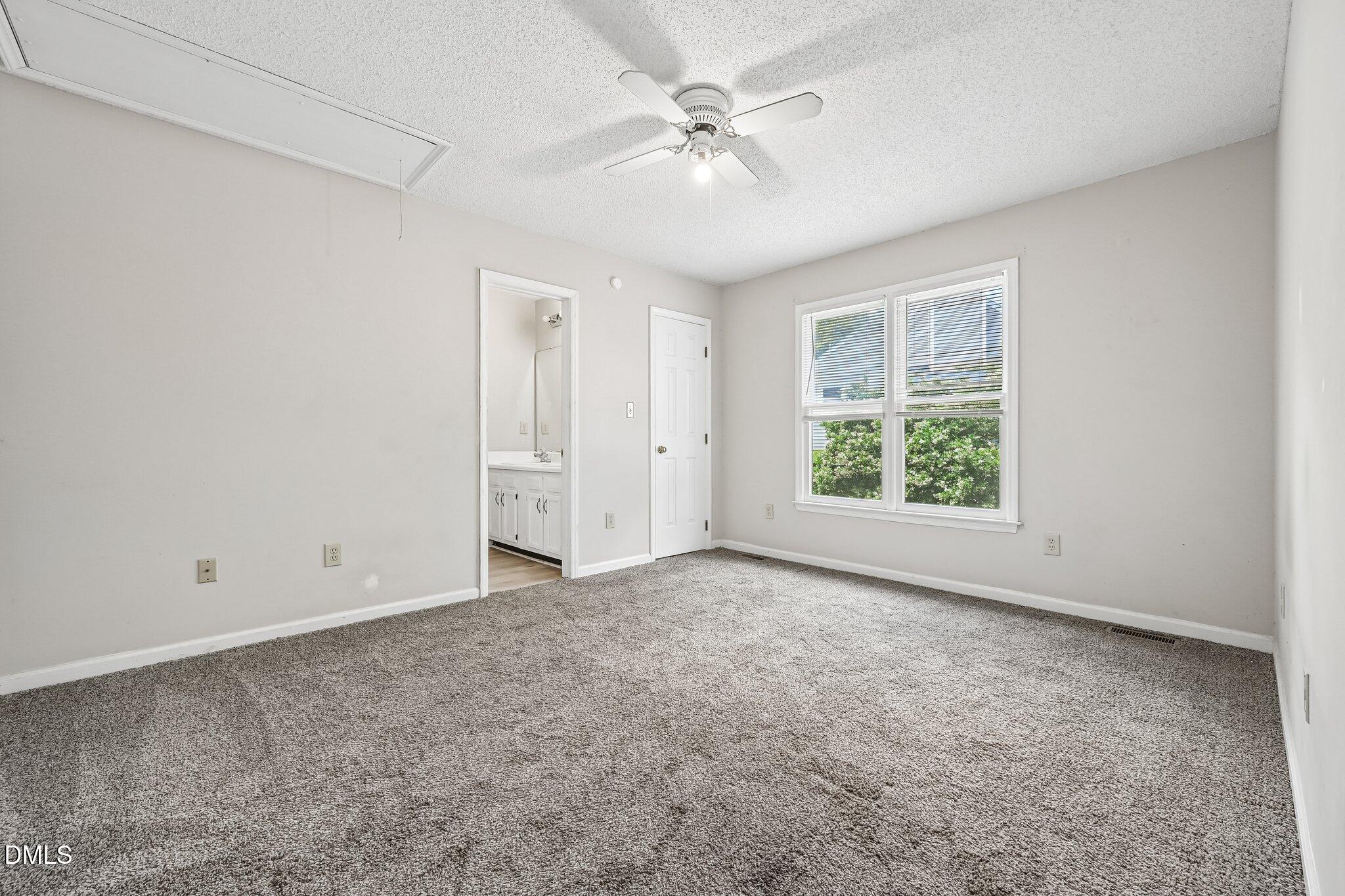 2800 West Jameson Road Raleigh, NC 27604 - Photo 12 of 24 an empty room with windows and ceiling fan