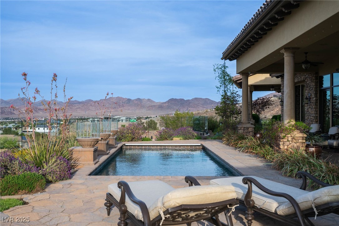 1123 Christian Road Henderson, NV 89002 - Photo 16 of 83 Outdoor pool featuring a patio and a mountain view