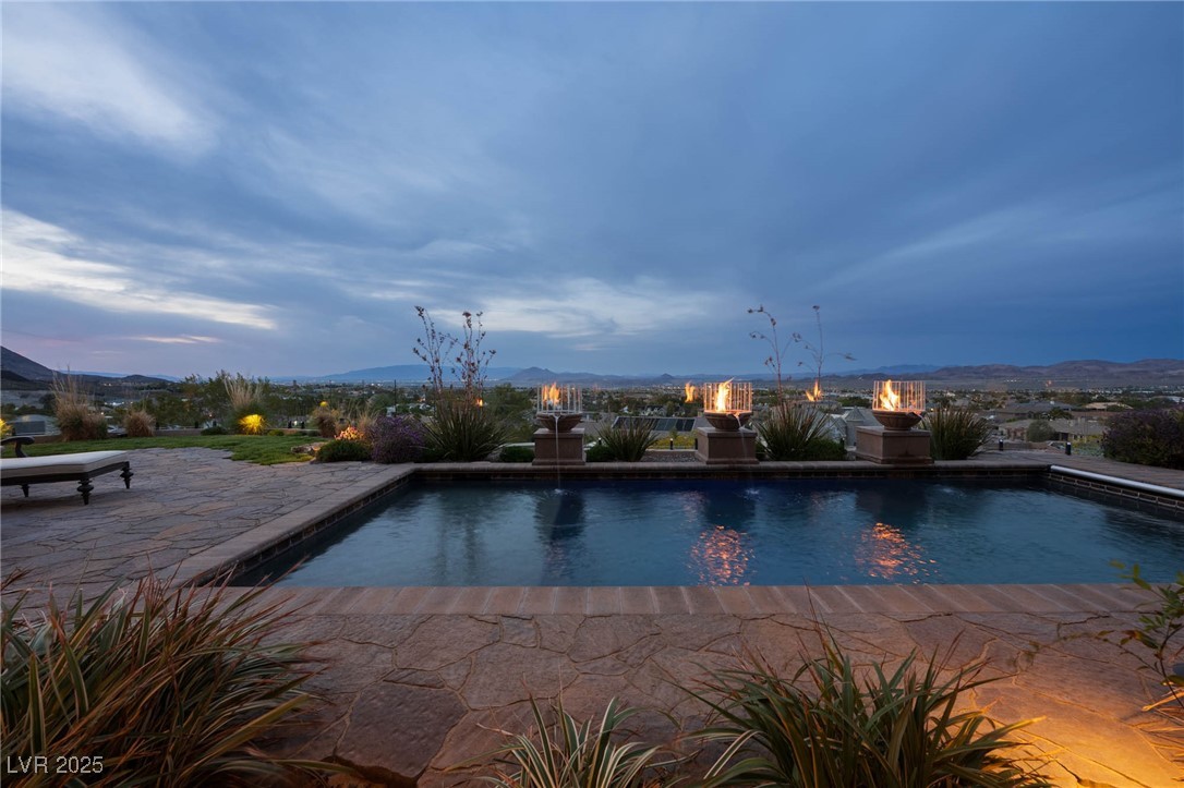 1123 Christian Road Henderson, NV 89002 - Photo 17 of 83 Pool at dusk with valley and mountain view