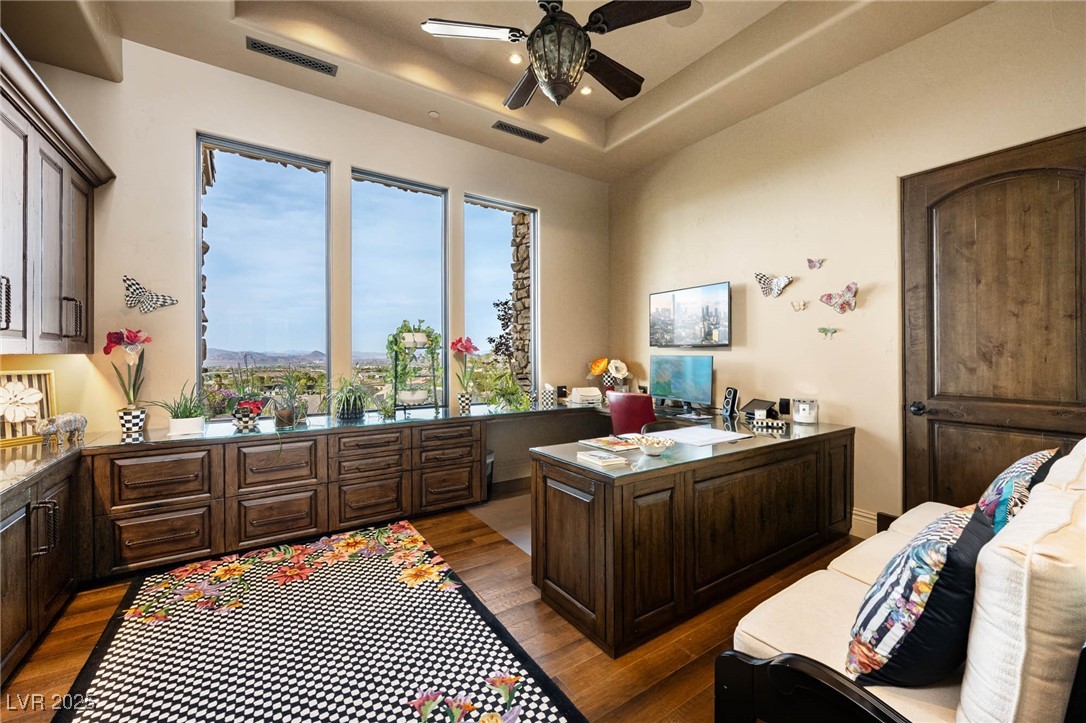 1123 Christian Road Henderson, NV 89002 - Photo 63 of 83 Office space featuring visible vents, a tray ceiling, a ceiling fan, and wood finished floors