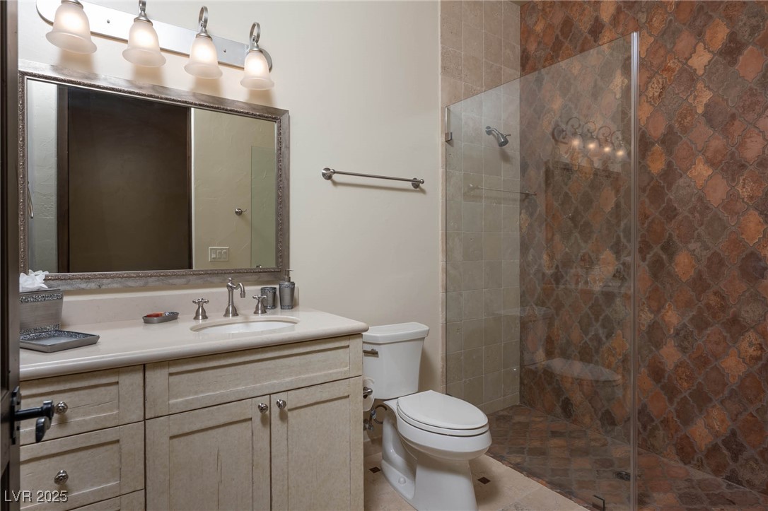 1123 Christian Road Henderson, NV 89002 - Photo 71 of 83 Shared bath with tiled shower, vanity, and toilet