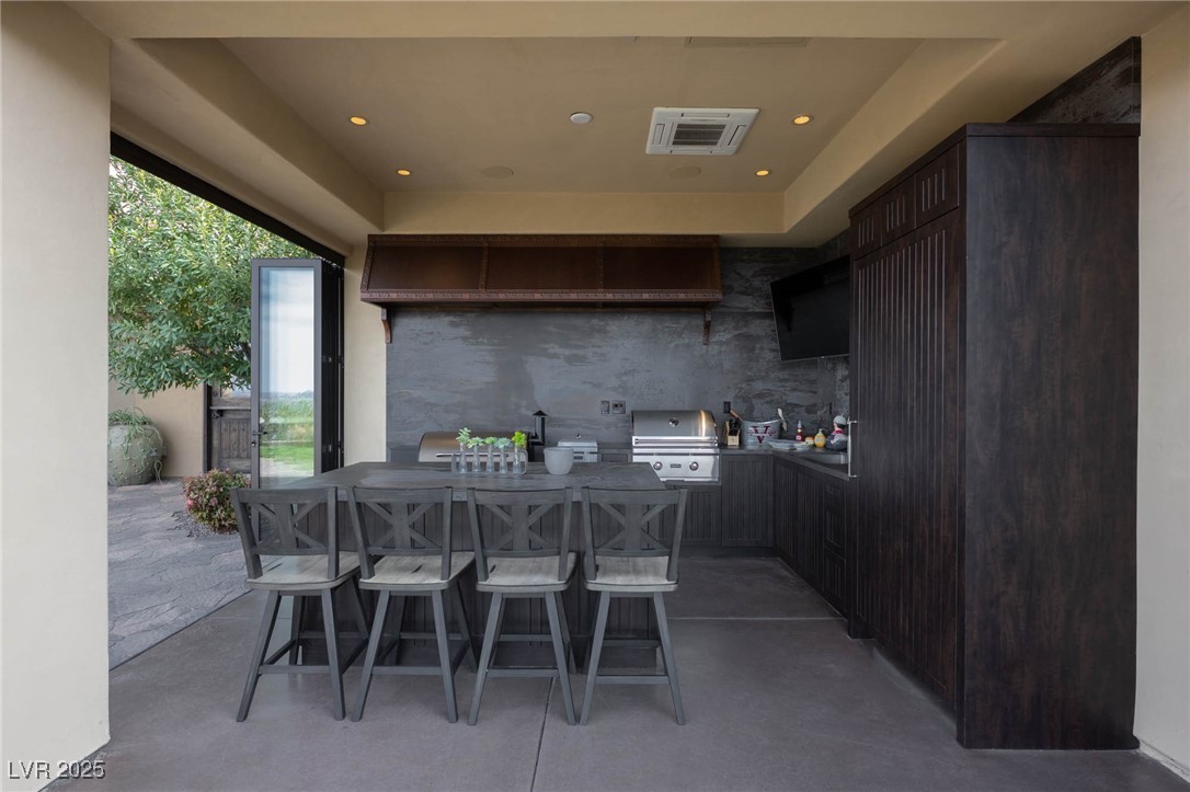 1123 Christian Road Henderson, NV 89002 - Photo 10 of 83 View of patio / terrace with a grill, outdoor dining space, and visible vents