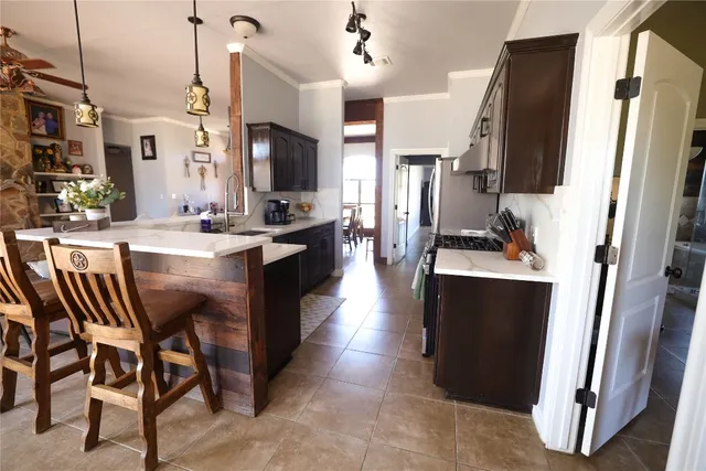 a large kitchen with a table and chairs