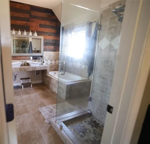 a bathroom with a sink and mirror