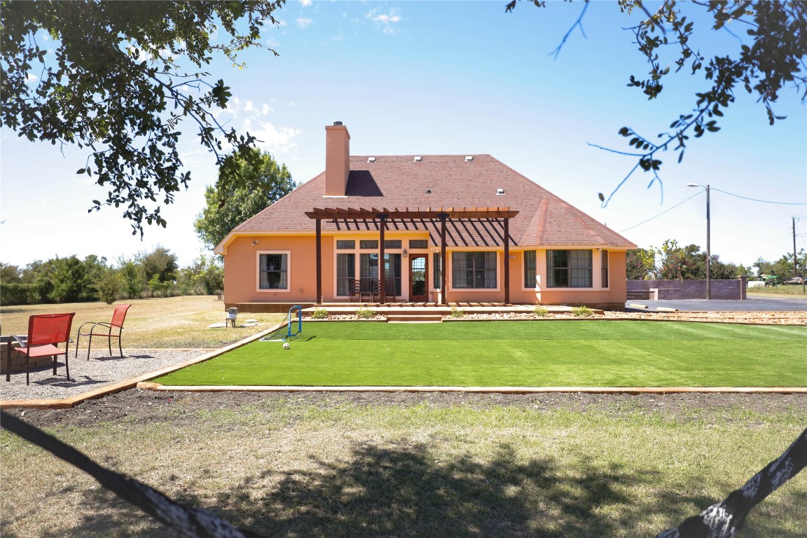 535 Upper Elgin River Road Elgin, TX 78621 - Photo 4 of 28 a view of a house with a swimming pool