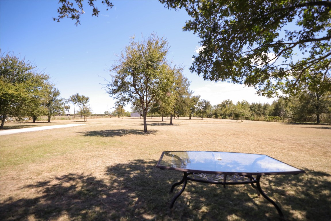 535 Upper Elgin River Road Elgin, TX 78621 - Photo 8 of 28 a view of a swimming pool with a patio