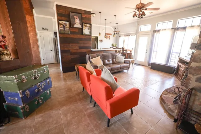 a living room with furniture and a large window