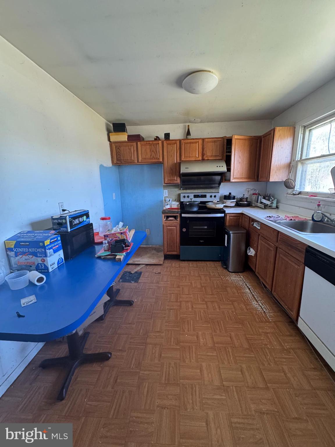 26 Nicholas Street Pemberton, NJ 08068 - Photo 2 of 7 a kitchen with stainless steel appliances granite countertop a sink dishwasher stove and cabinets