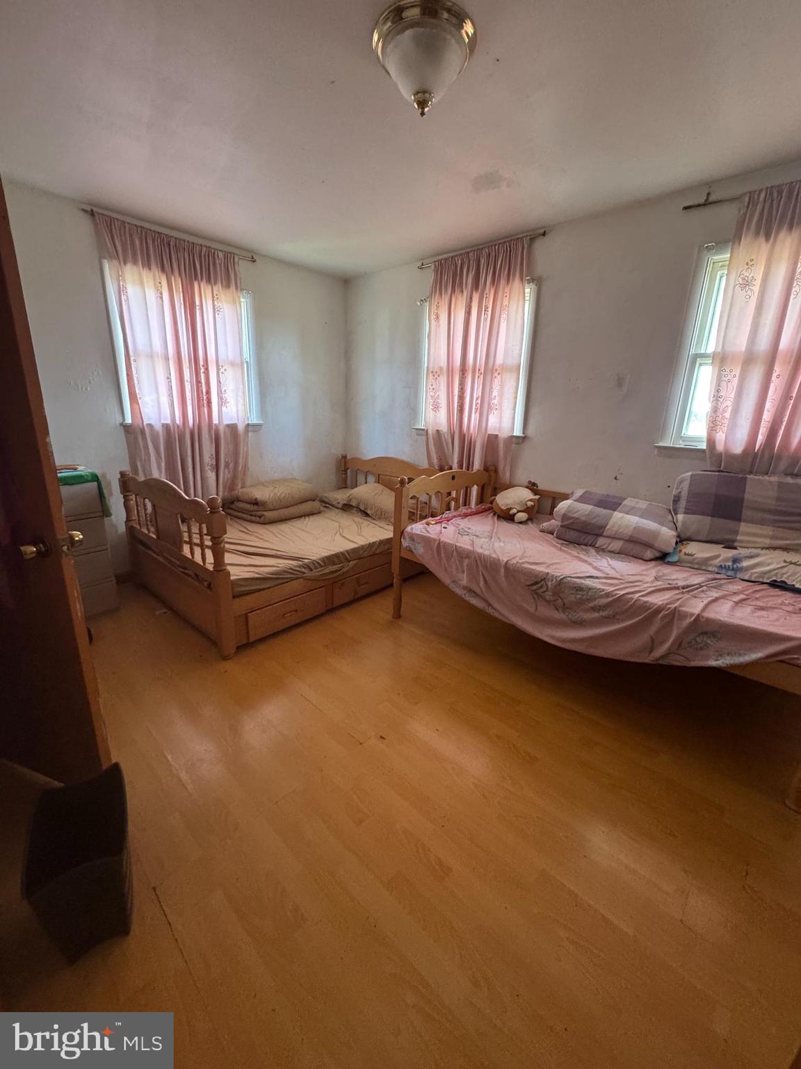 26 Nicholas Street Pemberton, NJ 08068 - Photo 4 of 7 a spacious bedroom with a bed and a window