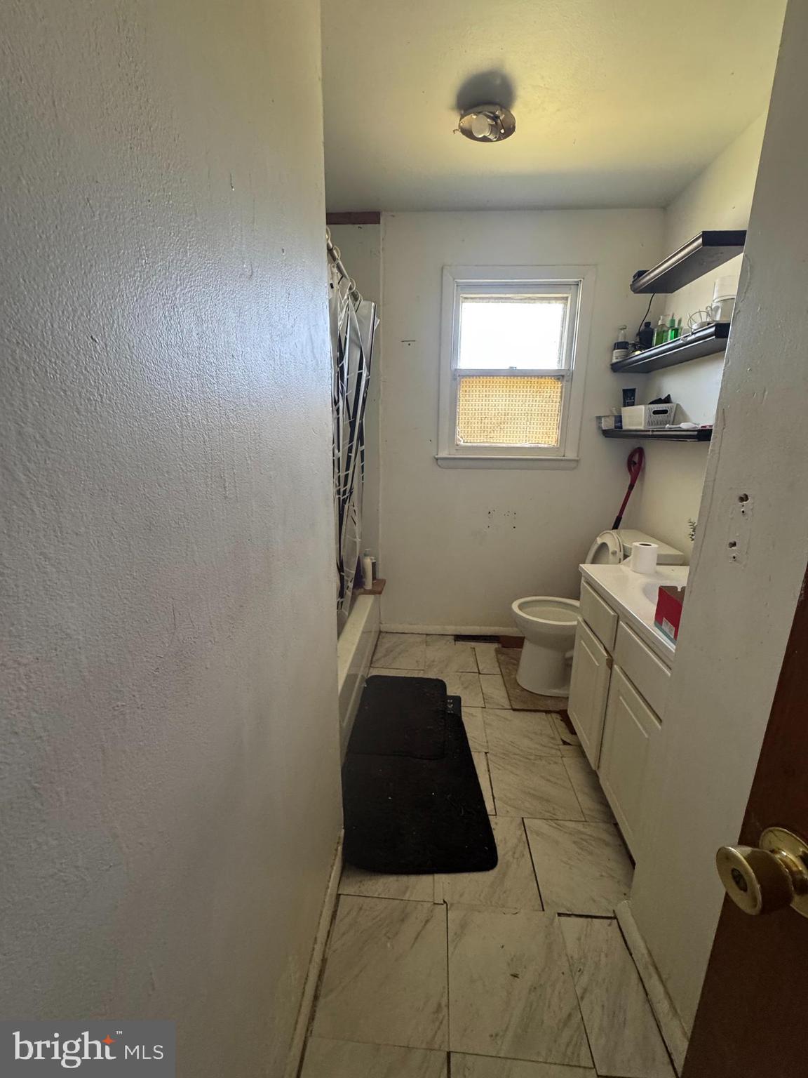 26 Nicholas Street Pemberton, NJ 08068 - Photo 5 of 7 a bathroom with a sink a toilet and shower