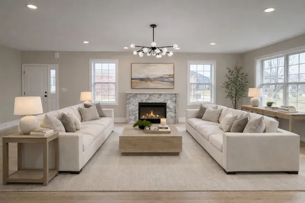 a living room with furniture and a fireplace