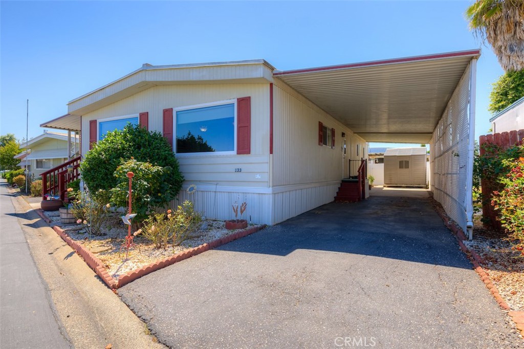 1901 Dayton Road, Unit 133 Chico, CA 95928 - Photo 2 of 36 a front view of a house with garden