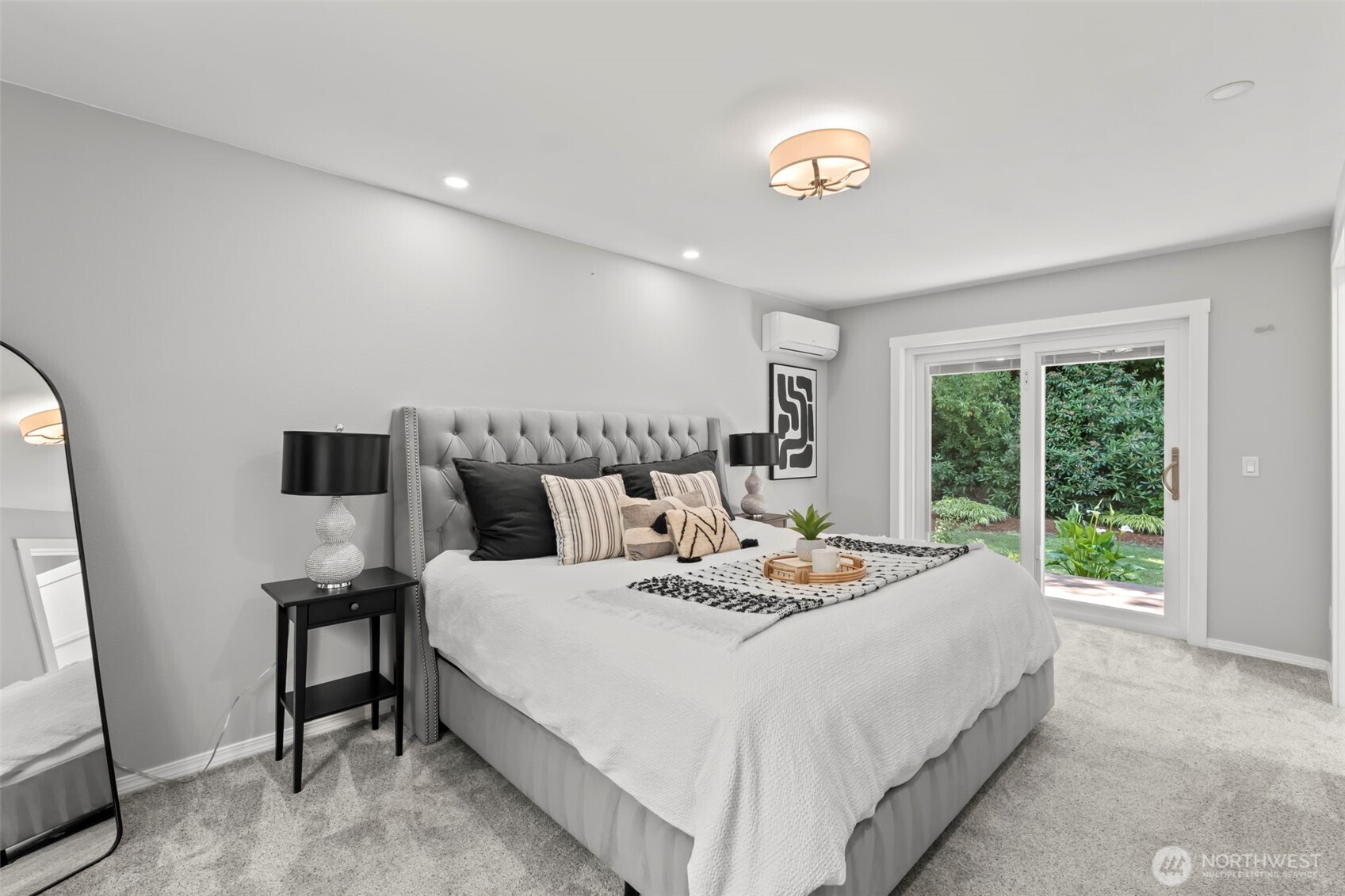 12170 Viewcrest Place Northeast Bainbridge Island, WA 98110 - Photo 14 of 37 a bedroom with a bed and a potted plant