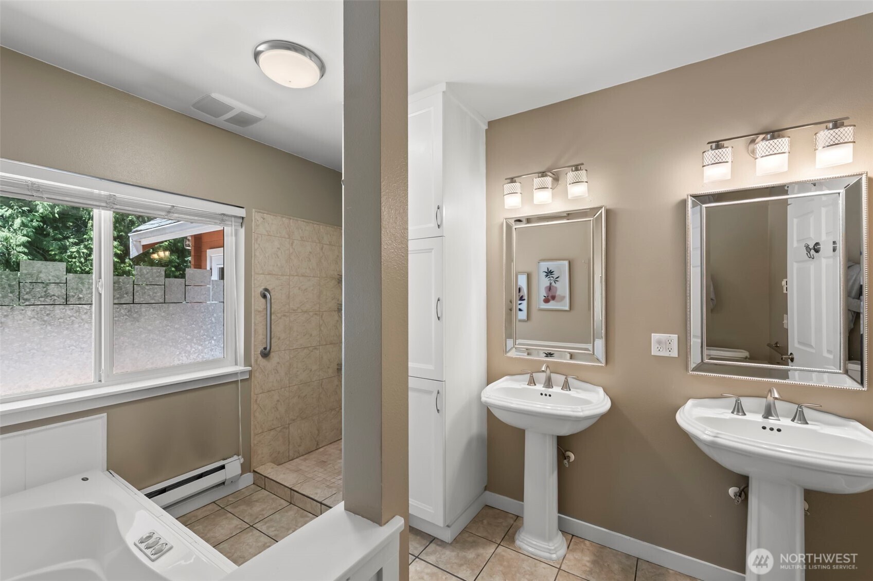 12170 Viewcrest Place Northeast Bainbridge Island, WA 98110 - Photo 18 of 37 a bathroom with 2 sink and a mirror