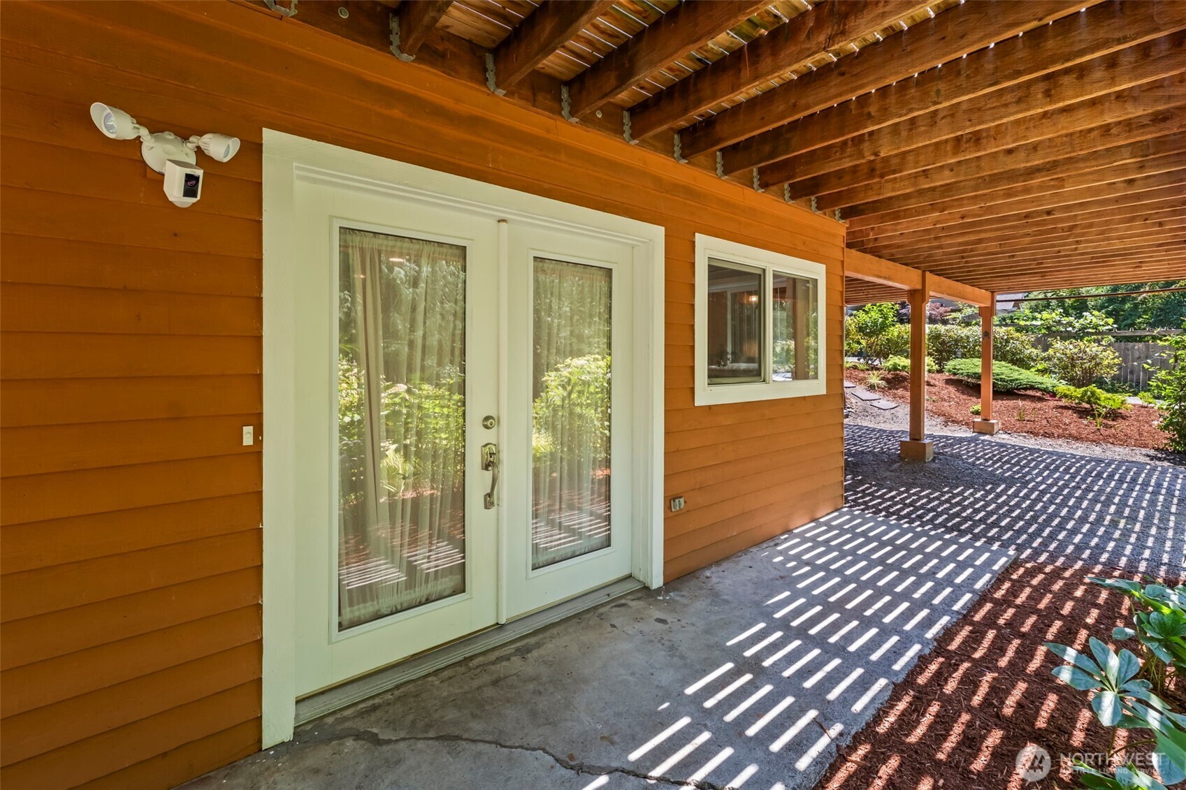 12170 Viewcrest Place Northeast Bainbridge Island, WA 98110 - Photo 20 of 37 a view of a porch with wooden floor