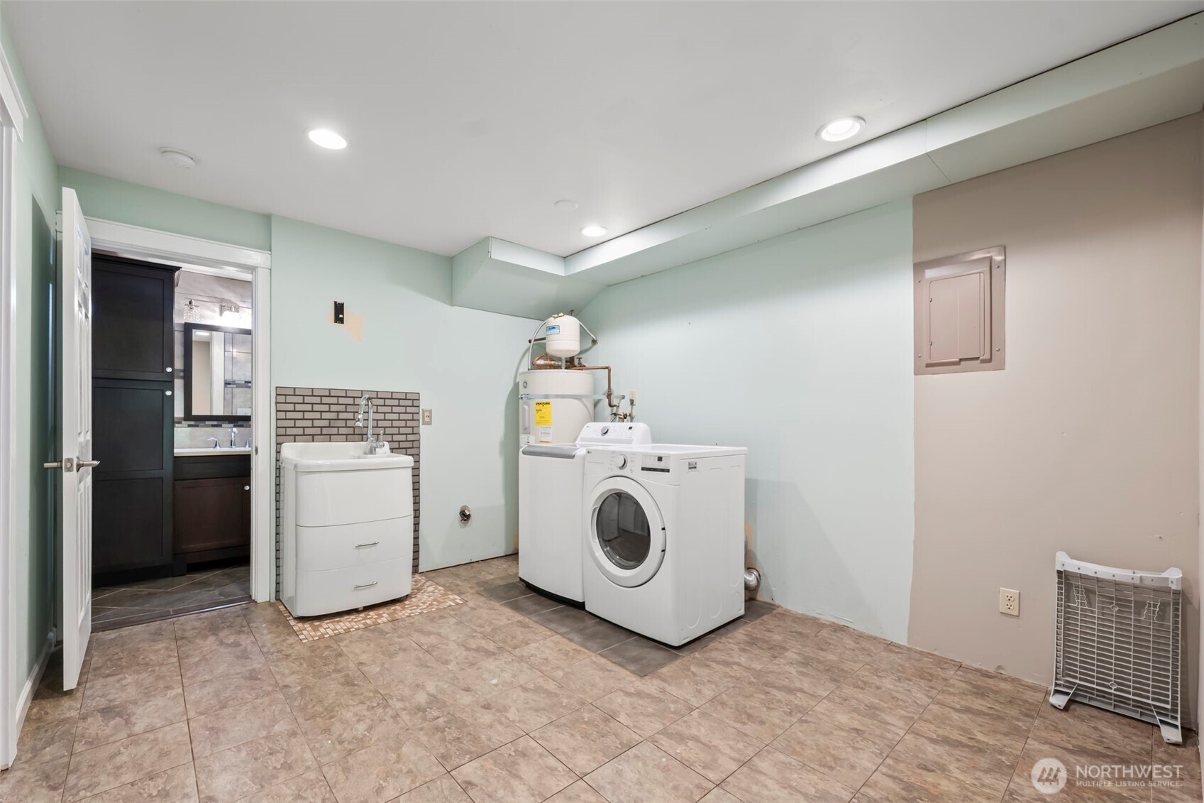 12170 Viewcrest Place Northeast Bainbridge Island, WA 98110 - Photo 21 of 37 a utility room with dryer and washer
