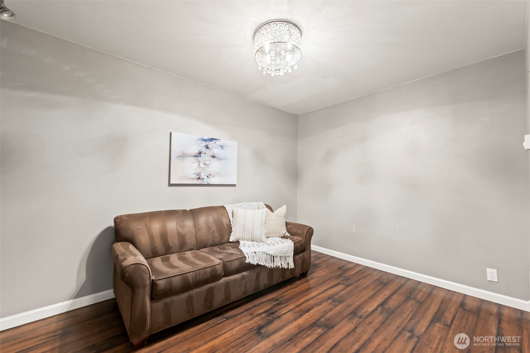 12170 Viewcrest Place Northeast Bainbridge Island, WA 98110 - Photo 23 of 37 a living room with furniture and a wooden floor