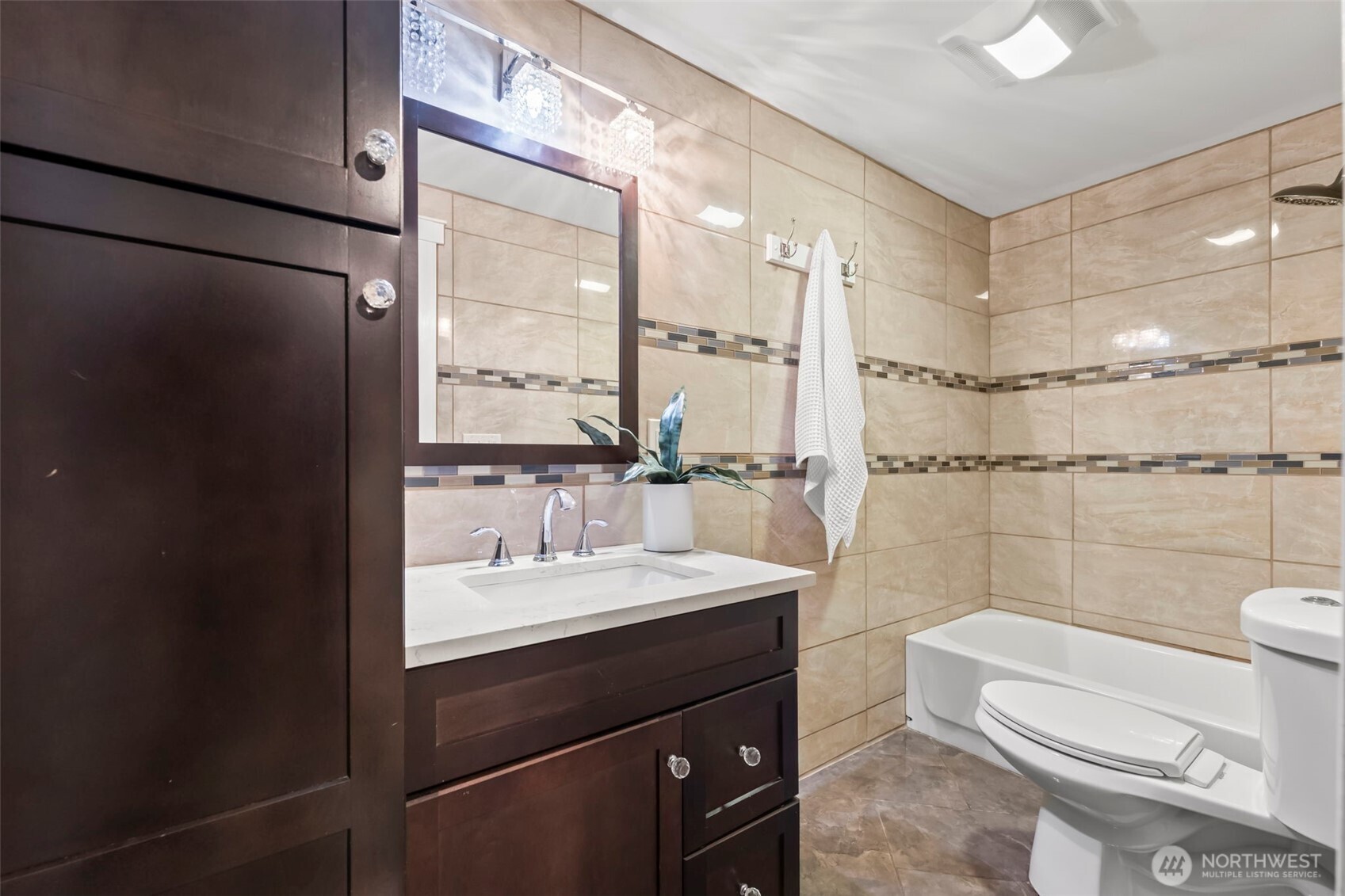 12170 Viewcrest Place Northeast Bainbridge Island, WA 98110 - Photo 24 of 37 a bathroom with a sink a toilet and shower